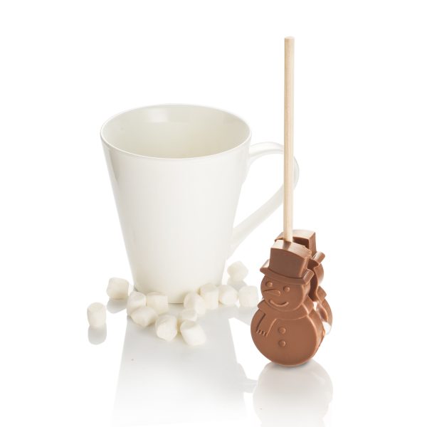 snowman hot chocolate stirrer next to a cup